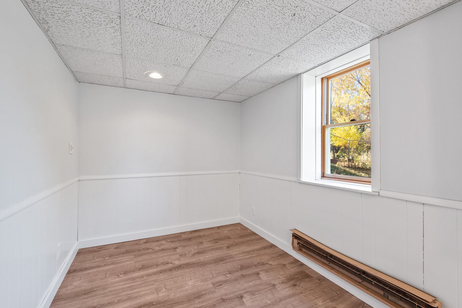Bright empty room with clean timber floors