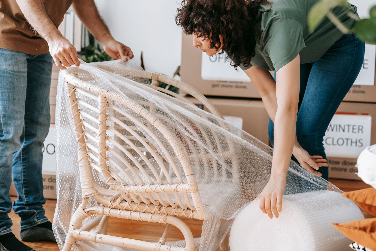 Chair being wrapped in bubble wrap before loading